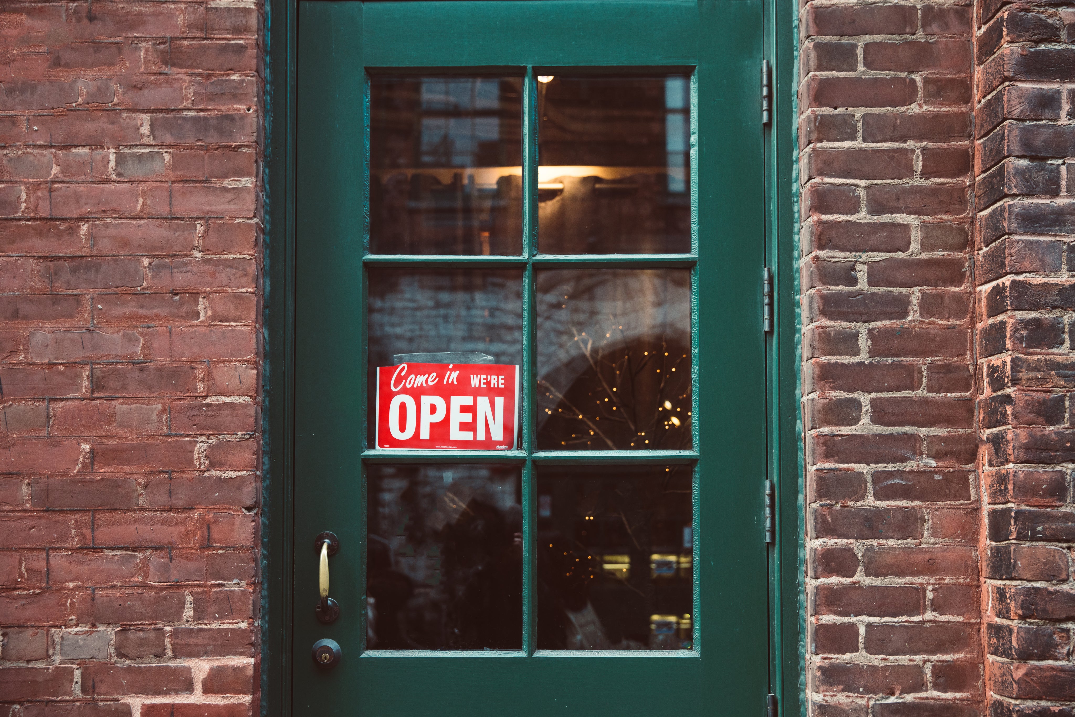 Green door with open sign